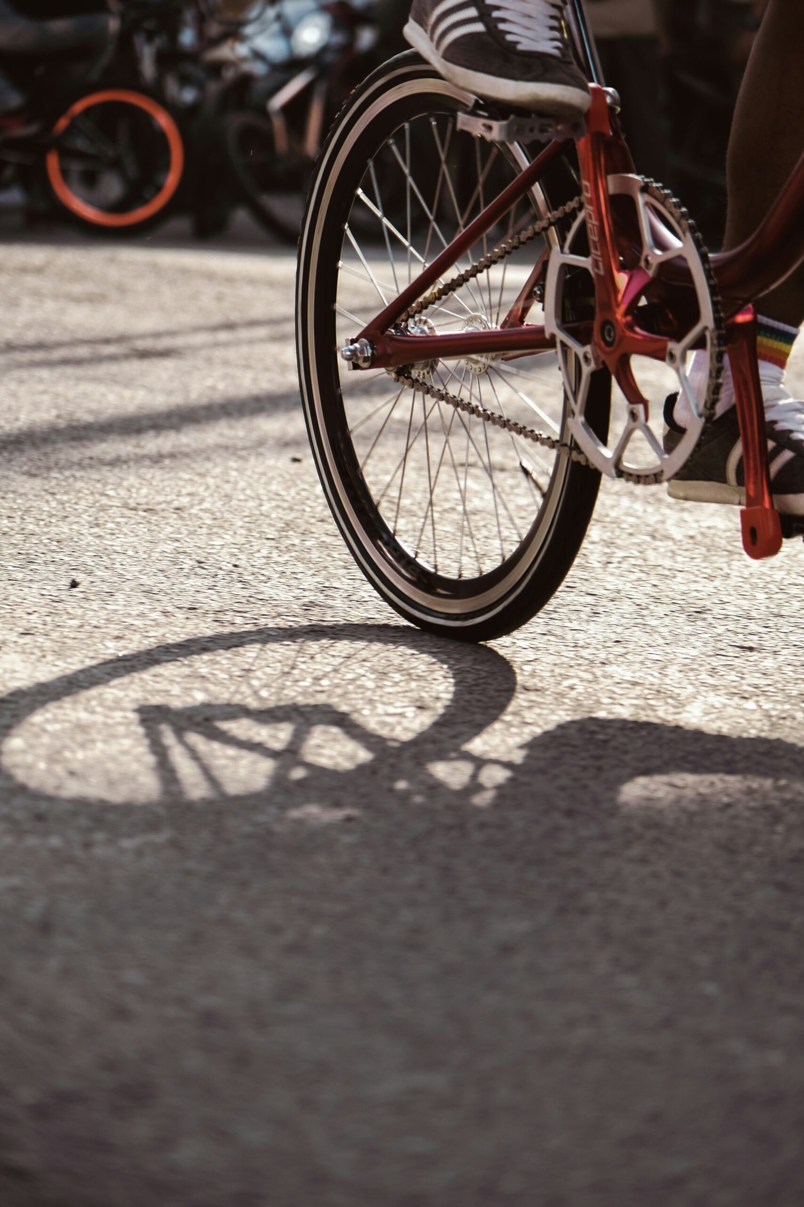 a person riding a bike down a street